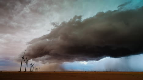 dramatic storm clouds over a wind farm