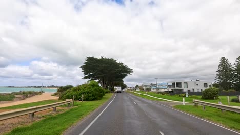 Coastal Road with Houses and Trees