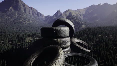 stacked tires create an unusual landmark in a scenic mountain environment