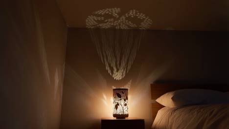 bedroom with illuminated lamp and shadow patterns