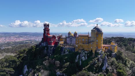 drone video of pena palace in sintra with colorful towers