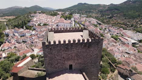 aerial around castelo de vide castle tower, typical alentejo village as background