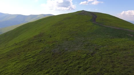 aerial flight over green hill mountains. fpv dynamic drone shot