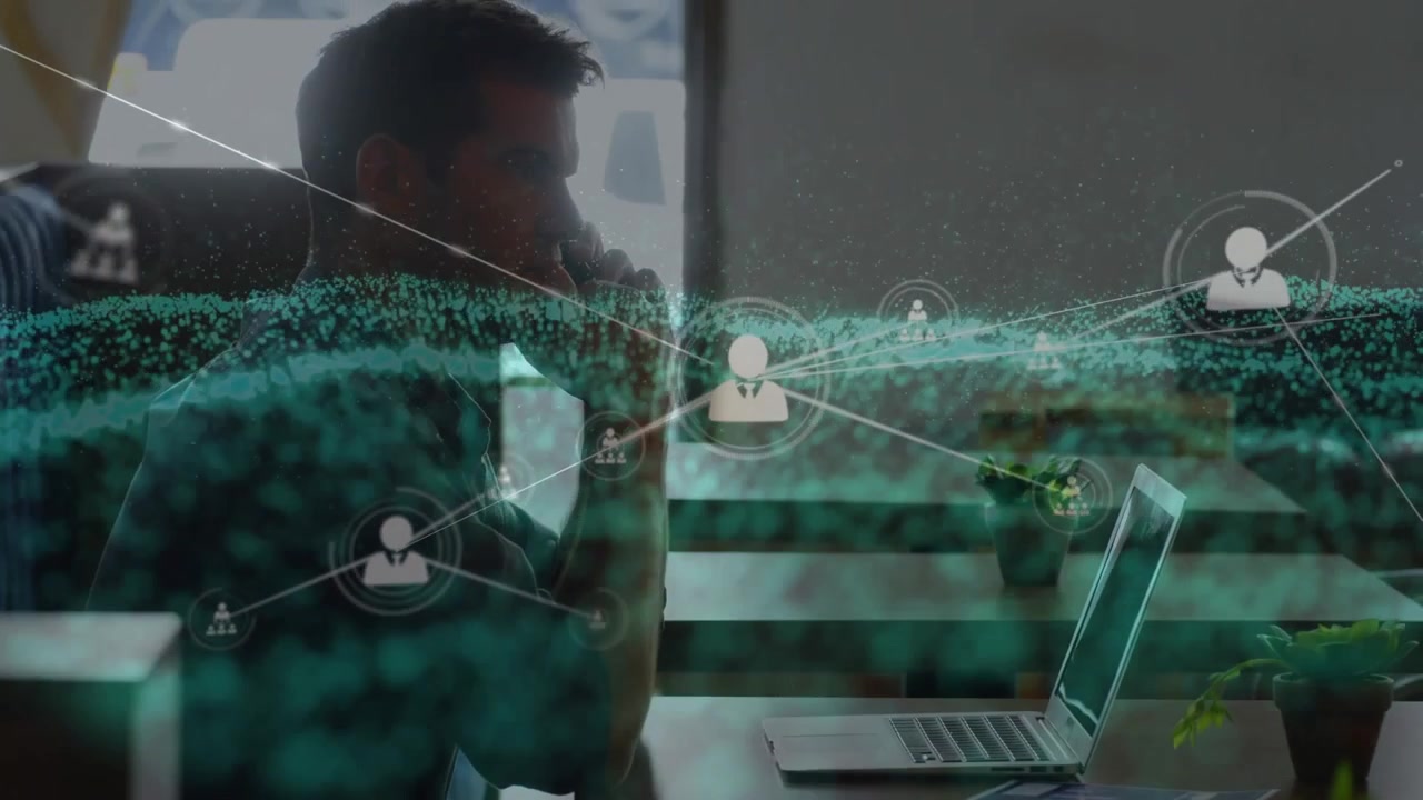 Animation of network of profile icons and digital wave over man talking on smartphone at office