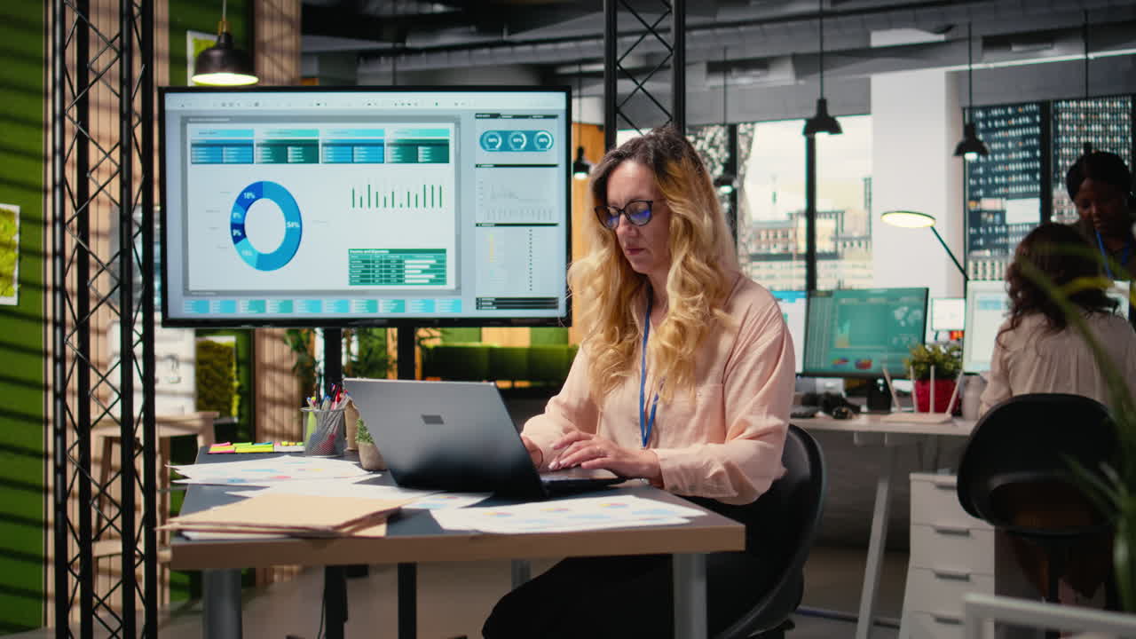 Vertical Video Chief executive officer works with confidence in a modern office setup