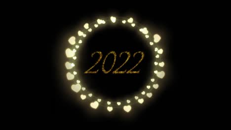 animation of 2022 text in gold with new year celebration heart fairy lights on black background