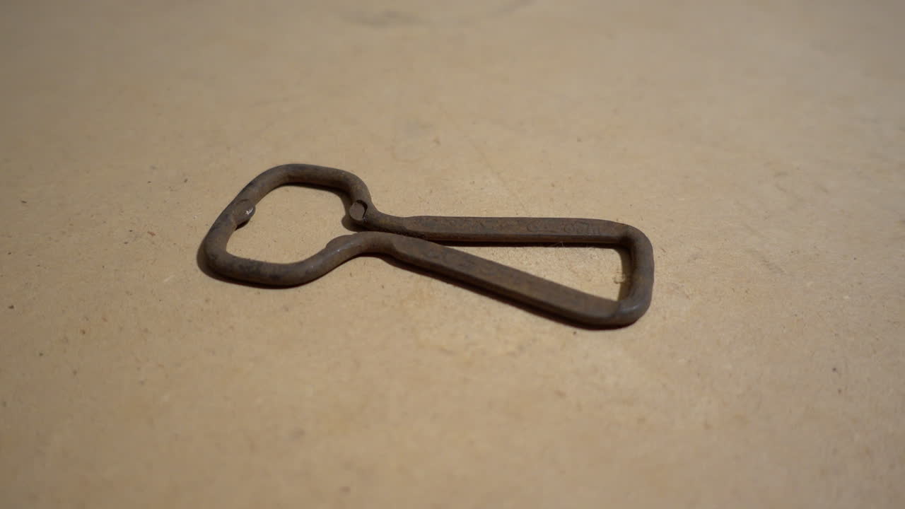 Rusty bottle opener (church key) before electrolytic cleaning