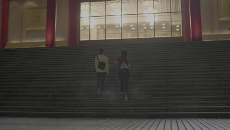 women walking up staircase taipei