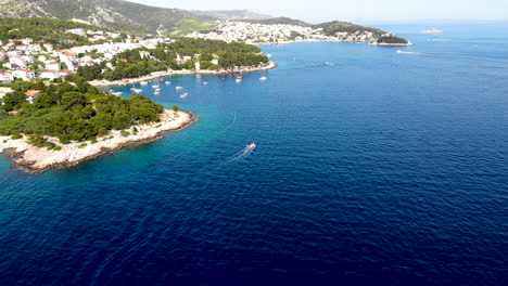 Flying-over-the-beautiful-historical-village-on-the-Island-Hvar,-Croatia