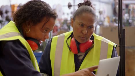 worker discussing over laptop in rope making industry 4k