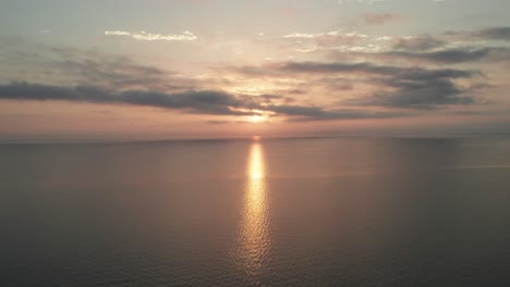 sunrise reflected on lake biwako japanese postcard of calm zen vibes aerial drone static shot