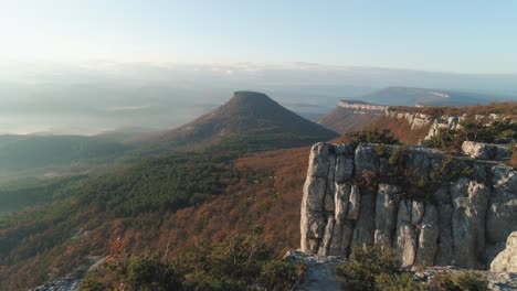 aerial view of mountainous landscape with fog