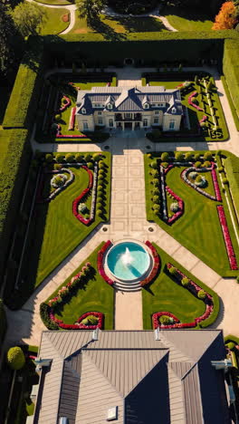 aerial view of a luxurious mansion and formal garden