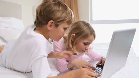 children playing with a laptop