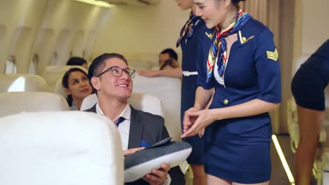 Cabin-crew-give-service-to-passenger-in-airplane