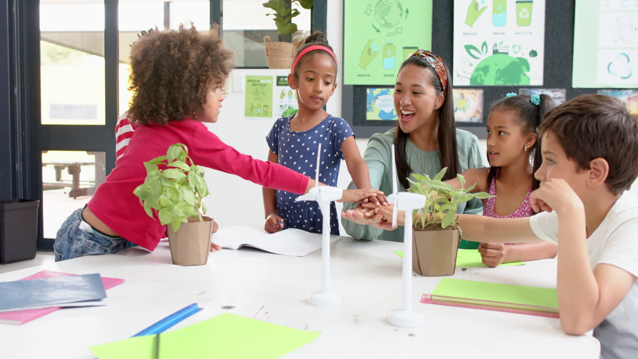 In school, teacher and students discussing plants and renewable energy projects