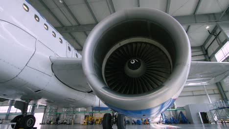 airplane engine maintenance in hangar