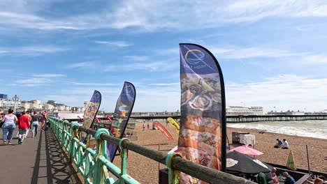 people walking on brighton beach promenade