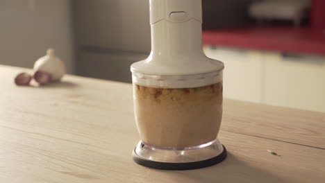 preparing hummus or chickpea dip in a blender