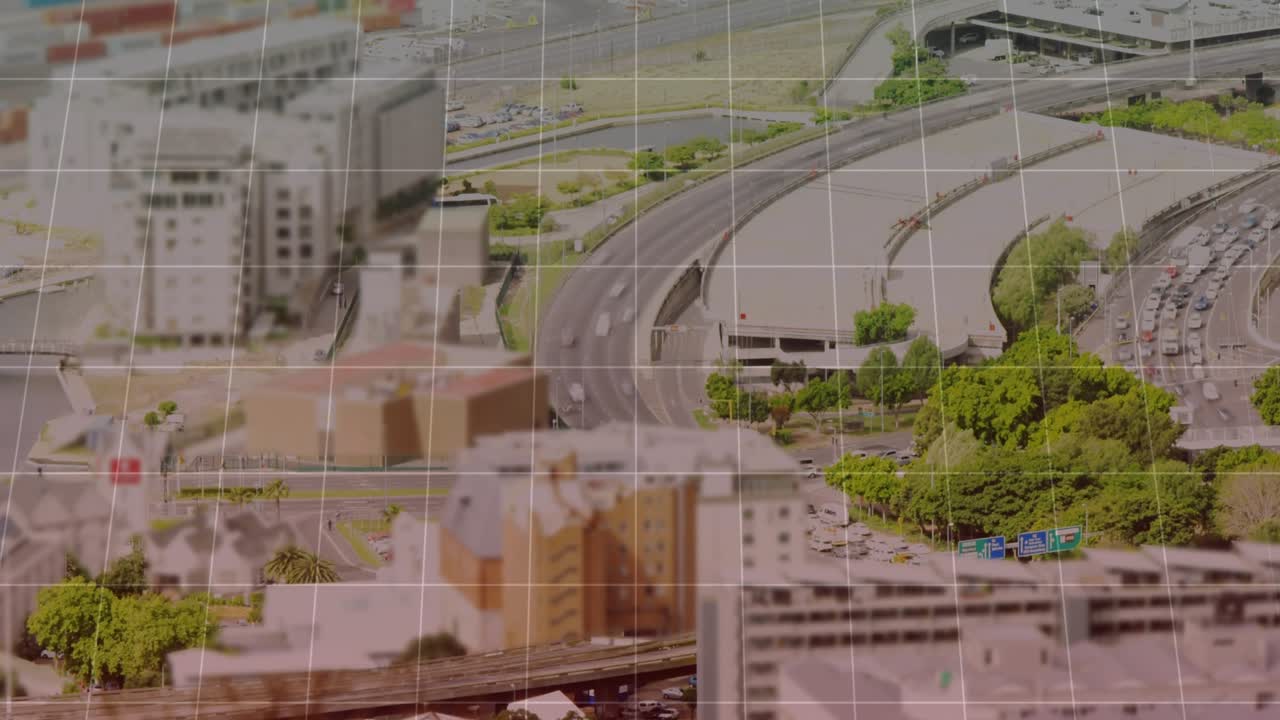 Grid overlay fading in, red line graph rising and falling to map traffic over city highways