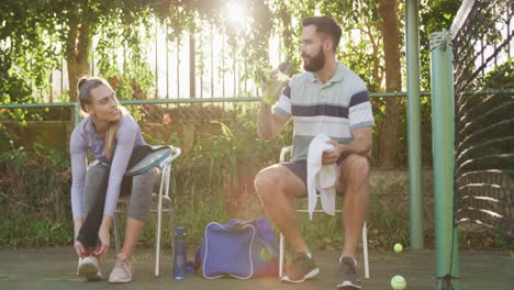 Video-of-happy-caucasian-couple-on-having-break-the-court