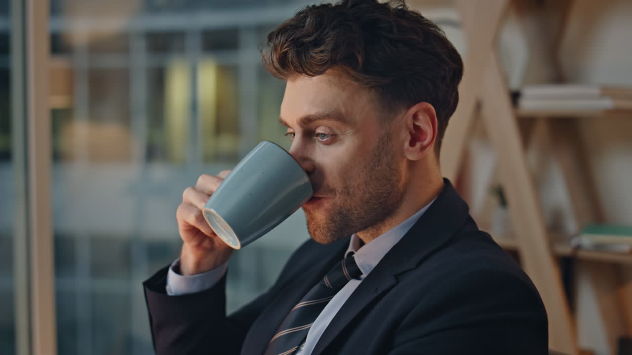 Successful executive enjoy coffee at office looking relaxed closeup portrait