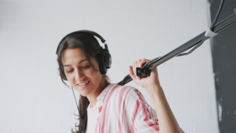 female sound recordist holding microphone on video film production in white studio