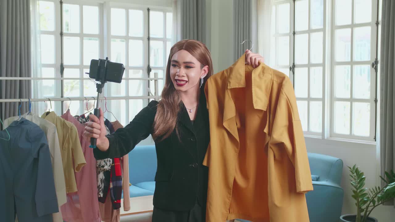 Young Transgender Woman Fashion Blogger Selling Clothes Online By Live Streaming On Mobile Phone, Selfie