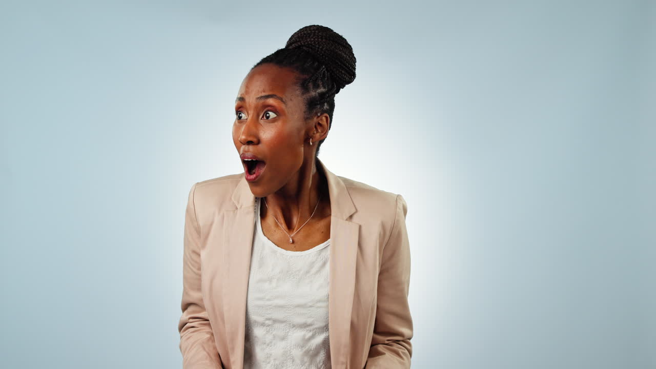Portrait, woman and shocked in studio on blue