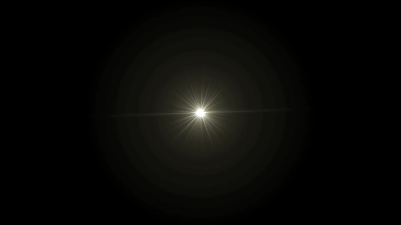 el destello realista de la lente de luz sobre un fondo negro.