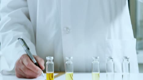 Male-scientist-experimenting-in-laboratory-4k