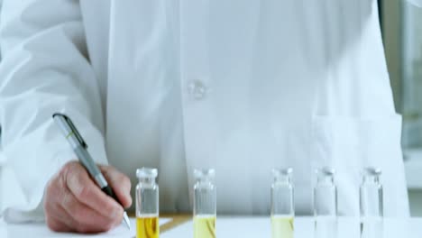 male scientist experimenting in laboratory 4k