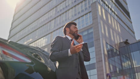 professional lawyer consulting cellphone on business street. businessman calling