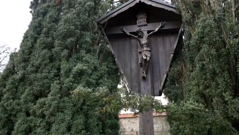 wooden crucifix in a garden setting