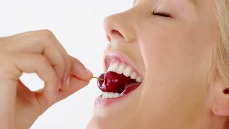 Clos-up-of-beautiful-woman-eating-cherry