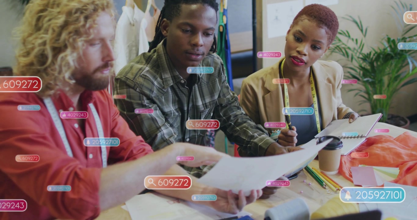 Vertical video: Lead handing sheet sparking AR tags on swatches, fashion team noting edits