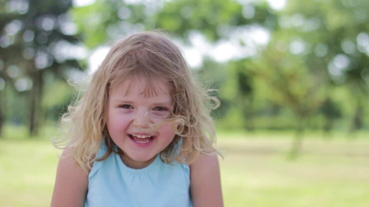 Little girl in the park , laughing-1