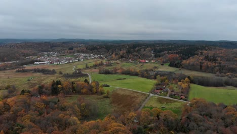 aerial footage across housing, forests and fields near kallered, molndal, gothenberg, sweden