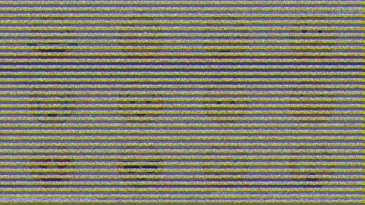Digital animation of tv static effect over multiple face emoji against grey background