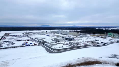Aerial-Towards-Compressor-Station-For-Natural-Gas-In-Snow-During-Winter
