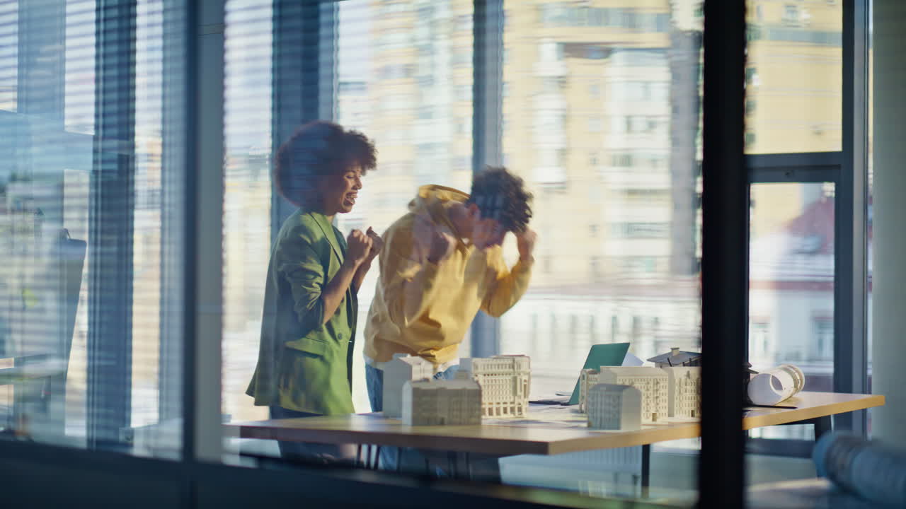 Happy realtors giving five making profitable real estate sale in modern office