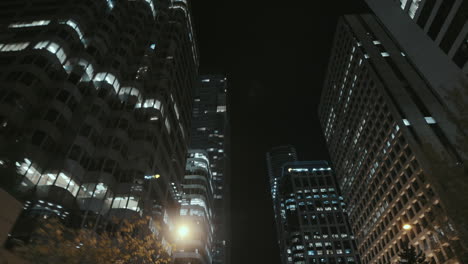 low angle wide dynamic shot of high rise building at night, vancouver, canada