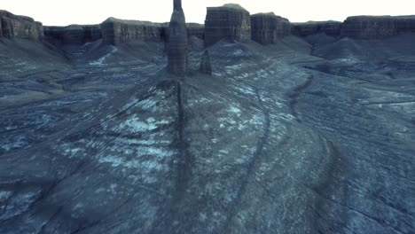 sharp rock formations in mountainous valley under sunset sky