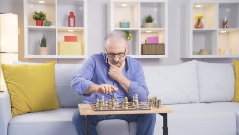 the old man plays chess by himself and is thoughtful.