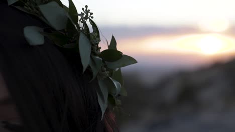 close up of a beautiful crown of leaves on the head of a bride on a bright summer day