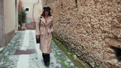 french woman walking in the streets of a small town in south italy