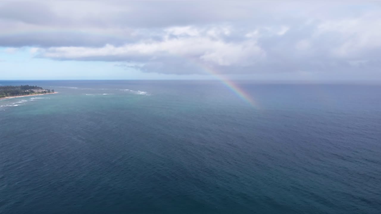 Rainbow at Lydgate Beach park near Wailua bay in Kauai. Holiday in paradise. Rainbow in the sky over the ocean of Hawaii