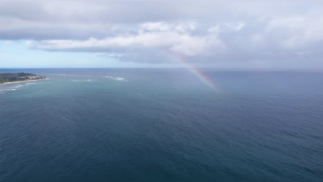 rainbow at lydgate beach park near wailua bay in kauai. holiday in paradise. rainbow in the sky over the ocean of hawaii