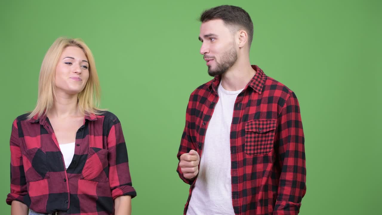 Young man presenting young woman together