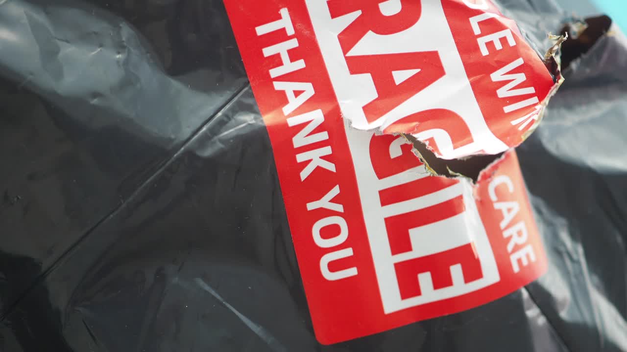 Fragile package with a torn sticker
